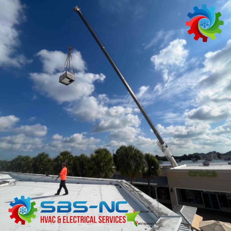 Crane setting a rooftop AC unit at a West Palm Beach retail center — SBS-NC commercial installation